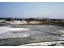 Frozen rice paddies behind billets
